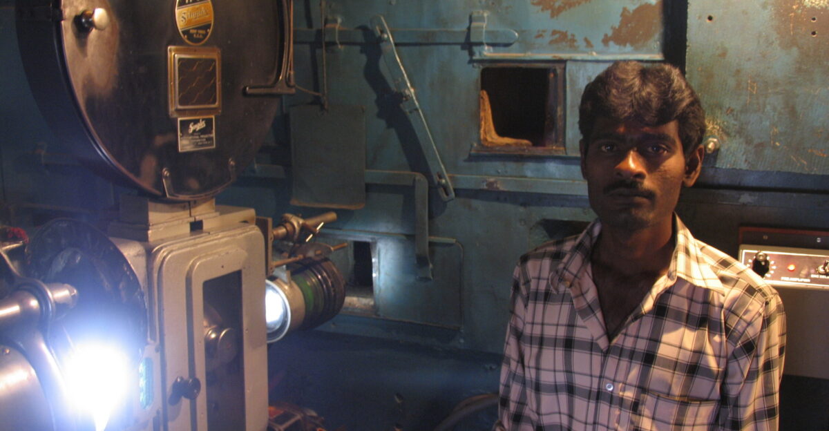 Projectionist in the projection room of the Elgin Talkies cinema hall in Bangalore Elgin Talkies is oldest cinema hall in operation in Bangalore The building was build in 1896 the year cinema was introduced in India by the Lumiere Brothers According to the projectionist the projection equipment currently used dates from 1930