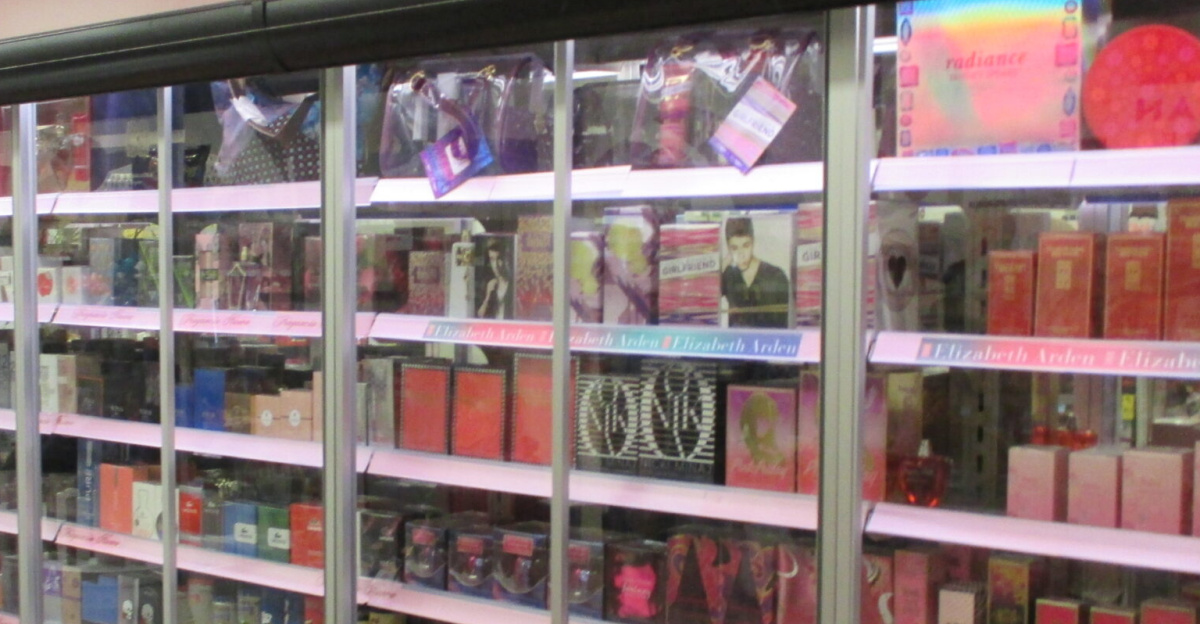 Shop with perfume bottles in locked shelves