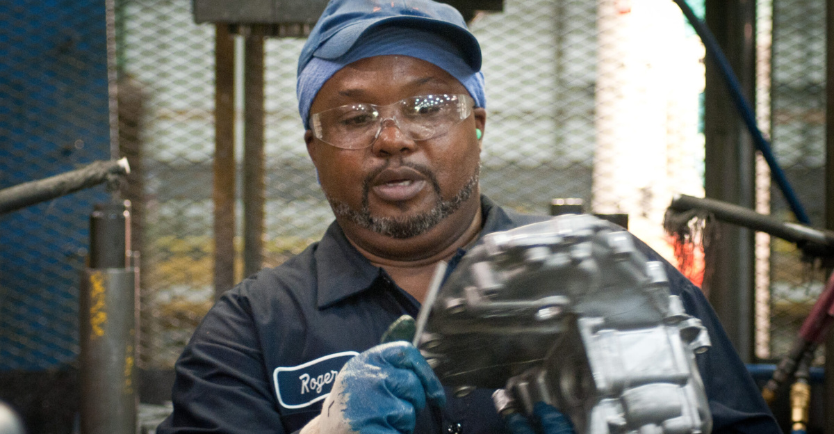 Trim Operator Roger Brown at Port City Group’s Port City Castings Corporation manufactures high-pressure aluminum die-castings, mostly for the automotive industry, in Muskegon, MI, facility on Wednesday July 20, 2011.  Port City Group boosted its employment by 12 percent over last year thanks to two Rural Business Guaranteed Loans totaling $9.6 million. In its 80,000 sq. ft. facility, machines that range from 800 – 1,600 tons, and cast A380 aluminum alloy products from melted ingots of aluminum, into automotive components of U.S.A. made vehicles.  The process features a variety of robotic presses; computer controlled machining; quality control facility; and complete measurement and testing laboratory. In 2009 banks were backing out of loans for PCG equipment purchase agreements. The U.S. Department of Agriculture (USDA) loan guarantee helped make the loan possible with its guarantee. PCG obtained the needed robotic and other equipment. This resulted in a stable workforce that has since grown. When asked about their USDA experience, Port City Group Sales Manager Laura LaGuire said, “It was great! They were very helpful. Everything that came up was handled smoothly, the money came in place when it was needed, and it was a very smooth transition.”  USDA Photo by Lance Cheung.
