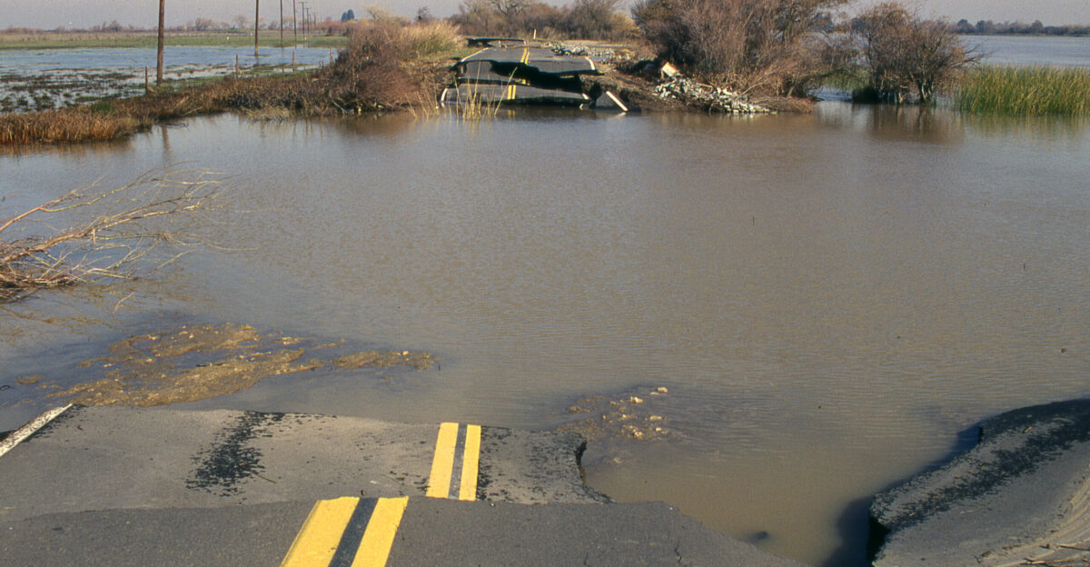 A levee breach near Rio Vista Calif in 1997 flooded neighboring land and destroyed a stretch of the levee road shown U S Army Corps of Engineers photo by Michael J Nevins Released