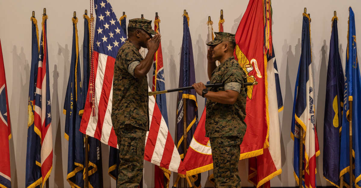 U.S. Marine Corps Sgt. Maj. James Meak, right, the outgoing sergeant major of Marine Aviation Logistics Squadron (MALS) 36, Marine Aircraft Group 36, 1st Marine Aircraft Wing, salutes Lt. Col. Calischaran James, the commanding officer of MALS-36, during a relief ceremony on Marine Corps Air Station Futenma, Okinawa, Japan, July 18, 2025. Sgt. Maj. Meak relinquished his post as the MALS-36 sergeant major, represented by the passing of the noncommissioned officer’s sword. (U.S. Marine Corps photo by Sgt. Gabriel Antwiler)