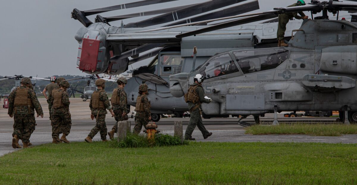 U S Sailors with 3rd Dental Battalion 3rd Marine Logistics Group are escorted by U S Marine Corp Cpl Hunter Blanchette a tiltrotor crew chief with Marine Medium Tiltrotor Squadron 262 VMM-262 Marine Air Group 36 1st Marine Aircraft Wing right as they prepare for flight in an MV-22 Osprey aircraft during Shika-X 24 at Marine Corps Air Station Futenma Okinawa Japan Nov 19 2024 3rd Dental Battalion collaborated with VMM-262 in order to enhance their coordination and operational proficiency in casualty transport during a simulated mass casualty scenario Shika-X 24 evaluated 3rd Dental Battalion s ability to manage mass casualty scenarios testing their application of triage techniques proficiency in Tactical Combat Casualty Care and coordination with each other in a combat environment U S Marine Corps photo by Lance Cpl Rachel Mason