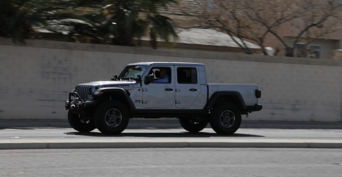 A Silver 2019-20 Jeep Gladiator driving in the eastbound lanes of West Ann Road Las Vegas Nevada