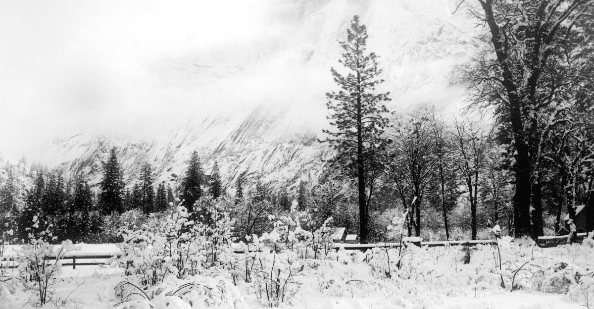 <br>
<dl><dd><i>Snow coats Yosemite Valley in Yosemite National Park, California, during a winter storm, 1850-1930</i></dd>
<dd>Photograph of snow coating Yosemite Valley in Yosemite National Park, California, during a winter storm, 1850-1930. A meadow beyond a wooden post and rail fence sits at the base of steep mountain slope. A building is visible at the far side of the meadow.</dd></dl>
<dl><dd><b>Call number</b>: CHS-1202</dd>
<dd><b>Photographer</b>: Fiske, George</dd>
<dd><b>Filename</b>: CHS-1202</dd>
<dd><b>Coverage date</b>: 1850/1930</dd>
<dd><b>Part of collection</b>: California Historical Society Collection, 1860-1960</dd>
<dd><b>Format</b>: glass plate negatives</dd>
<dd><b>Type</b>: images</dd>
<dd><b>Part of subcollection</b>: Title Insurance and Trust, and C.C. Pierce Photography Collection, 1860-1960</dd>
<dd><b>Repository name</b>: USC Libraries Special Collections</dd>
<dd><b>Accession number</b>: 1202</dd>
<dd><b>Microfiche number</b>: 1-60-50; 1-60-51</dd>
<dd><b>Archival file</b>: chs_Volume90/CHS-1202.tiff</dd>
<dd><b>Repository address</b>: Doheny Memorial Library, Los Angeles, CA 90089-0189</dd>
<dd><b>Geographic subject (country)</b>: USA</dd>
<dd><b>Format (aacr2)</b>: 2 photographs : glass photonegative, photoprint, b&w ; 17 x 22 cm.</dd>
<dd><b>Rights</b>: Digitally reproduced by the USC Digital Library; From the California Historical Society Collection at the University of Southern California</dd>
<dd><b>Subject (adlf)</b>: parks</dd>
<dd><b>Project</b>: USC</dd>
<dd><b>Repository email</b>: specol@usc.edu</dd>
<dd><b>Contributing entity</b>: California Historical Society</dd>
<dd><b>Date created</b>: 1850/1930</dd>
<dd><b>Publisher (of the digital version)</b>: University of Southern California. Libraries</dd>
<dd><b>Format (aat)</b>: photographic prints; photographs</dd>
<dd><b>Geographic subject (state)</b>: California</dd>
<dd><b>Legacy record ID</b>: chs-m14929; USC-1-1-1-14275</dd>
<dd><b>Access conditions</b>: Send requests to address or e-mail given. Phone (213) 821-2366; fax (213) 740-2343.</dd>
<dd><b>Subject (file heading)</b>: Natural features -- Parks -- Yosemite -- General views</dd>
<dd><b>Subject (lcsh)</b>: Yosemite national park (Calif.); Trees; Mountains</dd></dl>
