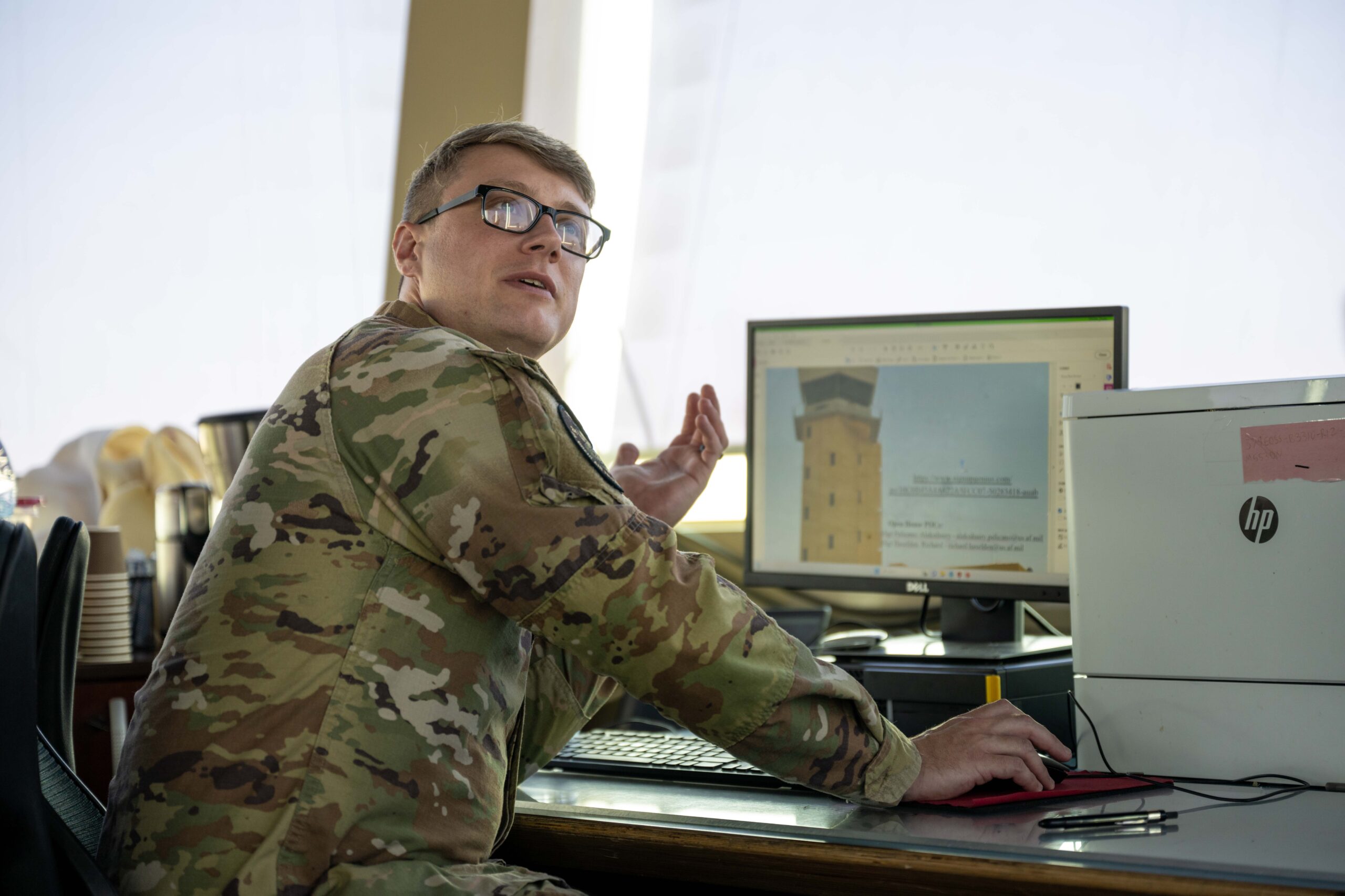 An air traffic controller assigned to the 379th Expeditionary Operations Support Squadron speaks with other controllers at an undisclosed location within the U S Central Command area of responsibility Aug 16 2024 Air traffic controllers communicate to all aircraft that connect to the installation to maintain flying schedules and guide ground operations personnel around the flightline U S Air Force photo