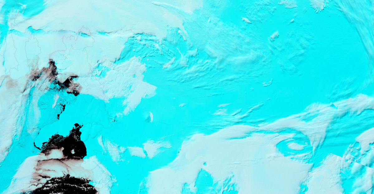 The massive Thwaites Glacier, which slides slowly over 74.5 miles (120 km) of coastline in West Antarctica, has been called “Antarctica’s riskiest glacier” due to the impact of the release vast amount of water as it melts. According to a recent publication by the Cooperative Institute for Research in Environmental Science at the University of Colorado Boulder (CIRES), the demise of this ice sheet poses the biggest threat for sea-level rise this century.
<p>The glacier, roughly the size of Spain, has been melting rapidly over the last decades, but the process has not been thoroughly studied. Recently, scientists have discovered the unsettling fact that that warmer water underneath the glacier is causing melting from below, which means the melting is occurring faster than previously anticipated. The enhanced melting also increases the likelihood of the collapse of the glacier—possibly within the next few decades.
</p><p>At the current melt rate, the glacier currently contributes four percent of annual global sea level rise. Should it collapse, scientists currently estimate that global sea levels would rise by several feet, a scenario that would cause substantial flooding in coastal areas around the world.
</p><p>Nearly 100 scientists have joined together in the International Thwaites Glacier Collaboration (ITGC) to conduct a five-year collaborative set of studies aimed at collecting instrument data throughout the glacier and adjacent ocean, and then modeling ice flow to predict the future of the Thwaites Glacier. To date, the ITGC has discovered many changes in the ice, the surrounding water, and the area where it floats off the underlying bedrock—insights that will help the understanding and potential mitigation of glacial change in a warming climate.
</p>
On January 1, 2022, the Moderate Resolution Imaging Spectroradiometer (MODIS) on board NASA’s Terra satellite acquired a false-color image of the Thwaites Glacier. This type of image uses infrared and visible light (Bands 7,2,1) to distinguish ice from water and cloud. Deep water appears dark inky-blue or black, while cloud looks white, and ice or snow shows as bright electric blue. Black lines have been overlain on the image to mark the edge of the continent. The brownish swirls appear to be sediment although it is possible the coloration comes from shadows. The long ice tongue of Thwaites Glacier can be seen protruding into the Amundsen Sea.