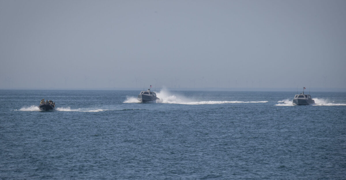 Special warfare operators from Georgia Romania Spain and the United States prepare to board a vessel during a visit board search and seizure VBSS evolution as a part of Trojan Footprint 21 off the coast of Mangalia Romania on May 7th 2021 Trojan Footprint 21 is Special Operations Command Europe s annual exercise to demonstrate proficiencies assess the readiness and lethality of our respective forces and to continue improving interoperability with allies and partners U S Navy Photo by Petty Officer First Class Patrick W Mullen III