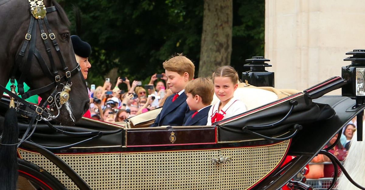 Trooping the Colour 2023 - From left to right: Queen Camilla, Prince George of Wales, Prince Louis of Wales, and Princess Charlotte of Wales riding in a horse-drawn carriage along The Mall towards Horse Guards Parade.