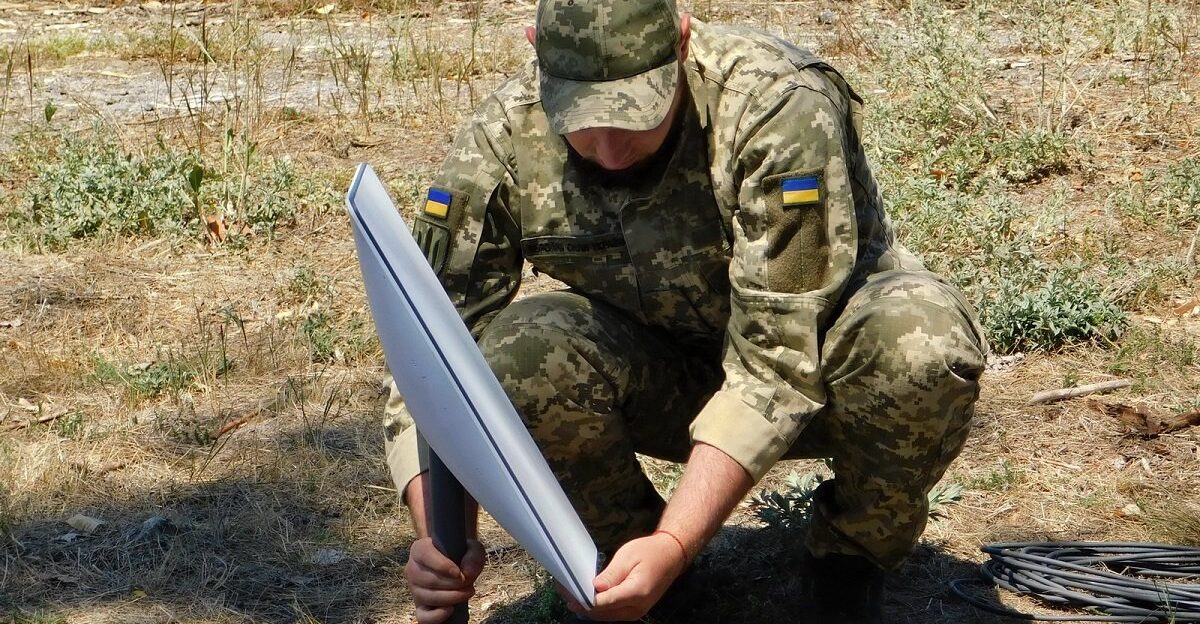 Support Forces of Ukraine soldier installing a Starlink terminal