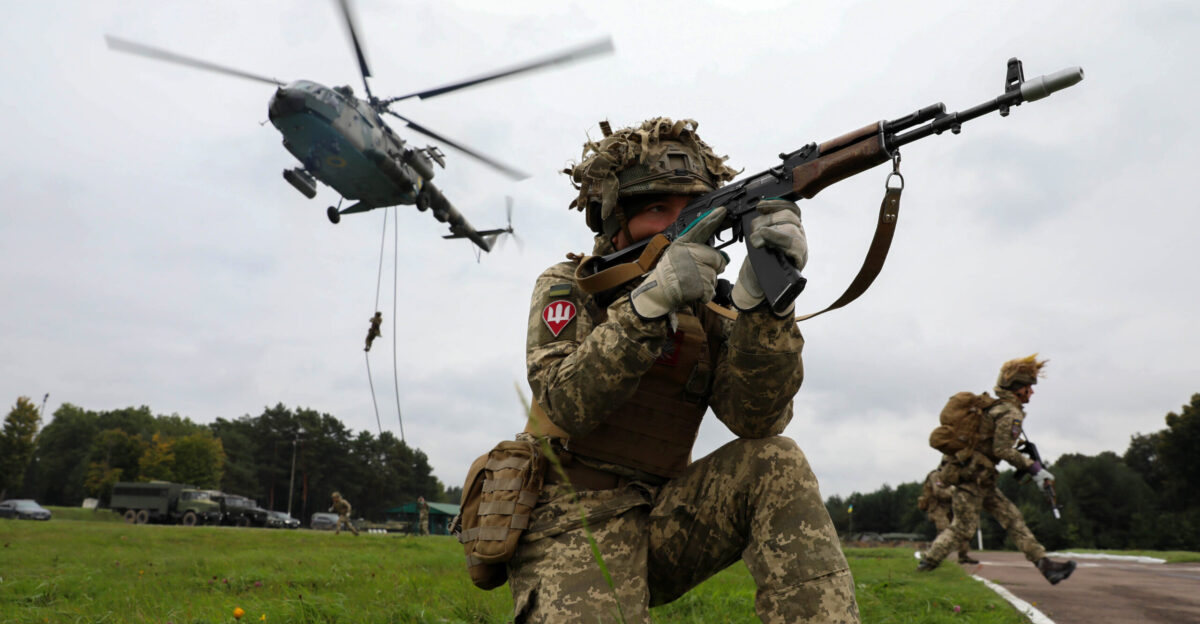 A Ukrainian Ground Forces soldier provides security during a fast rope from a Ukrainian Mi-8 helicopter as part of Rapid Trident 2021 at Combat Training Center-Yavoriv near Yavoriv Ukraine Sept 21 2021 Rapid Trident is 6 000 troops from 15 partner countries During the exercise joint jumps of Ukrainian and American paratroopers from a U S Army C-130 aircraft are planned U S Army photo by Spc Preston Hammon