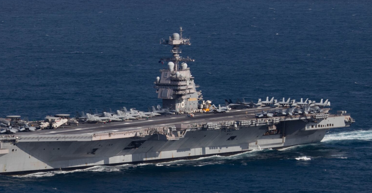 The U.S. Navy aircraft carrier USS <i>Gerald R. Ford</i> (CVN-78) steams the Atlantic Ocean during a simulated straits transit with the <i>Gerald R. Ford</i> Carrier Strike Group (GRFCSG) in the Atlantic Ocean, 9 October 2022. The <i>Gerald R. Ford</i> Carrier Strike Group was deployed in the Atlantic Ocean, conducting training and operations alongside NATO allies and partners since 5 October 2022. On deck are aircraft of Carrier Air Wing 8 (CVW-8).