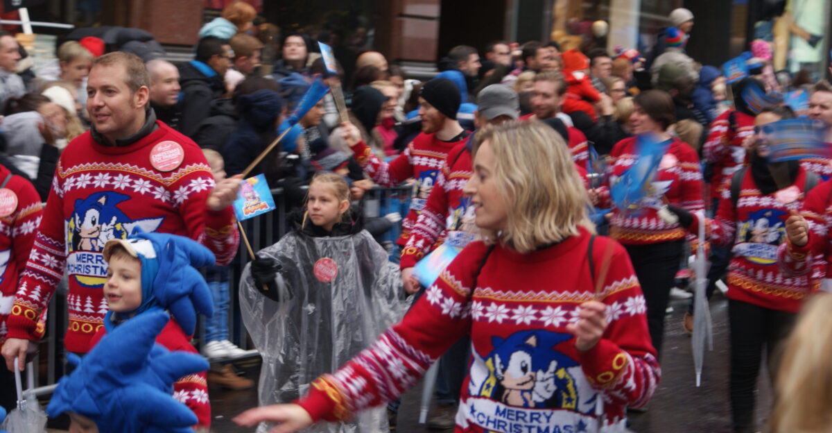 View of people with Sonic the Hedgehog Christmas jumpers in the Hamleys Toy Parade