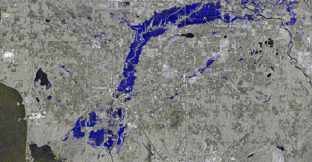 The US State of Washington is under a state of emergency following days of severe wind and rain leading to extensive flooding in parts of the state The extreme weather was caused by an atmospheric river a huge plume of moisture extending over the Pacific and into Washington Different satellites in orbit carry different instruments that can provide us with a wealth of complementary information to understand and to respond to flooding disasters The first image captured by the Copernicus Sentinel-2 mission shows the extent of the floods in the Nooksack River which spilled over its banks this week and washed out several roads in the process The flooding forced the evacuation of hundreds of residents and lead to the closure of schools More than 158 000 people were affected by power outages and disruptions to other services The conditions triggered mudslides in the region prompting the closure of the Interstate 5 but it has since reopened Optical satellite instruments such as the Copernicus Sentinel-2 satellites cannot see through clouds which is why radar missions like Sentinel-1 are particularly useful Radar images acquired before and after flooding events offer immediate information on the extent of inundation thanks to Sentinel-1 s ability to see through clouds and rain The radar image on the right uses information from two separate acquisitions captured by the Copernicus Sentinel-1 mission on 4 November and 16 November 2021 and shows the extent of the flooding of the Nooksack River in dark blue The Copernicus Sentinels are a fleet of dedicated EU-owned satellites designed to deliver the wealth of data and imagery that are central to the European Union s Copernicus environmental programme