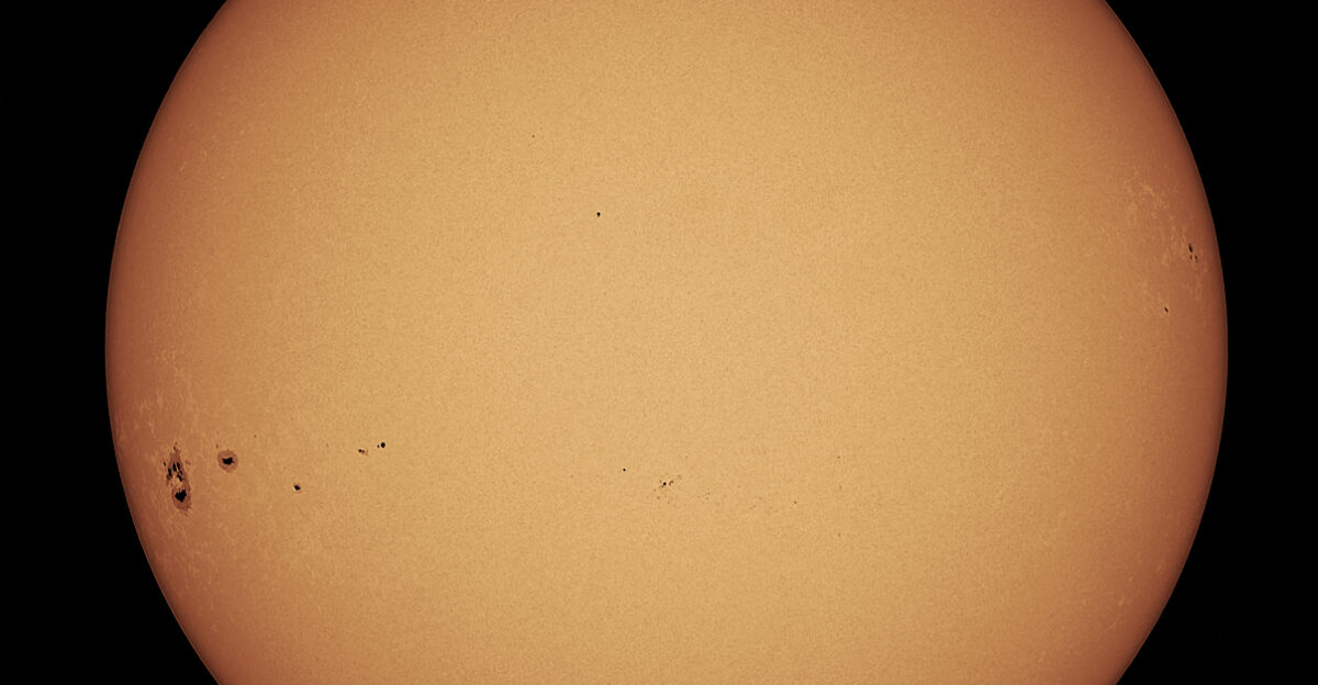 80mm refractor with Herschel wedge The large sunspot group at 9pm is AR 2209 which is really the massive AR 2192 returned again