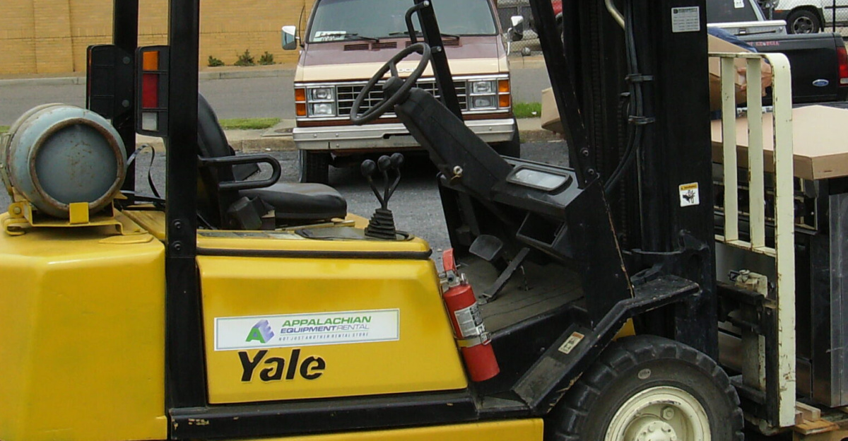 Yale forklift in parking lot of Our Community Place in Harrisonburg, Virginia loaded with kitchen equipment.
