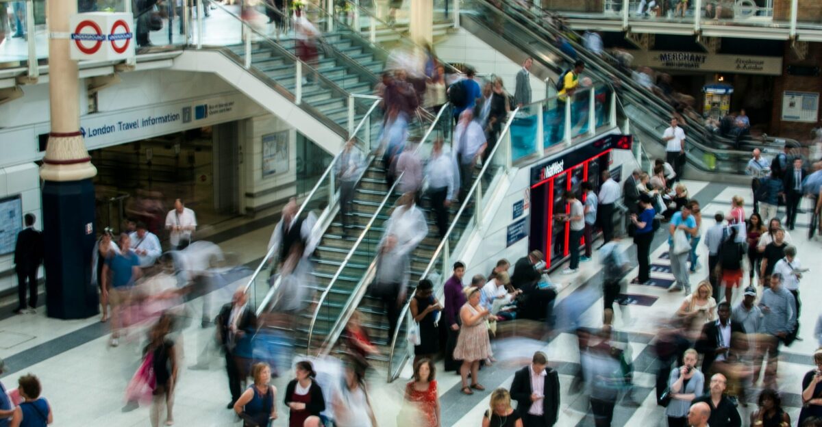 people standing and walking on stairs in mall