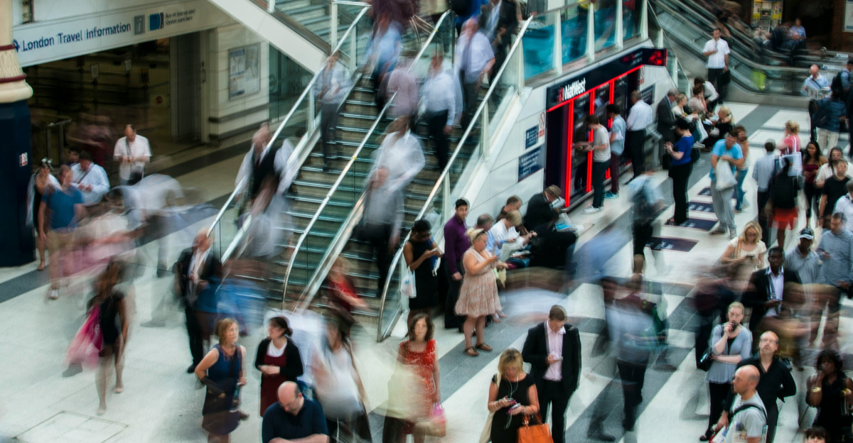 people standing and walking on stairs in mall