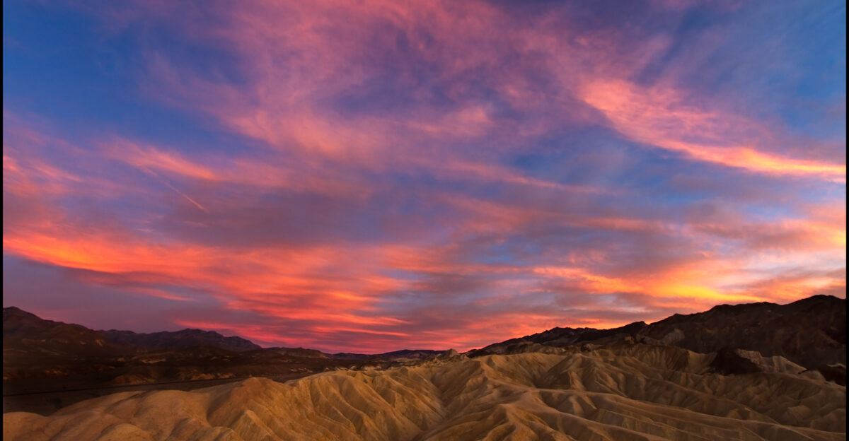 View of Zabriskie Point in Death Valley The sun is way to the right but there was so much color in the sky that even this side was nicely lit ISO 100 10mm f16 1 2sec