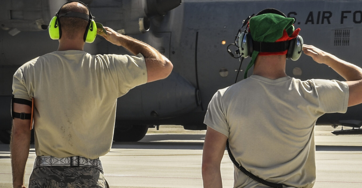 Staff Sgt. Solomon Faulkner, 374th Maintenance Squadron aerospace ground equipment craftsman, and Senior Airman Benjamin Campanella, 374th Maintenance Group crew chief, salute a C-130H Hercules assigned to the 36th Airlift Squadron before takeoff during Operation Christmas Drop at Andersen Air Force Base, Guam, Dec. 10, 2016. Each year OCD provides aid to over 30,000 islanders in Chuuk, Palau, Yap, Marshall Islands and the Commonwealth of the Northern Mariana Islands. (U.S. Air Force photo by Senior Airman Elizabeth Baker)
<br>Unit: 374th Airlift Wing