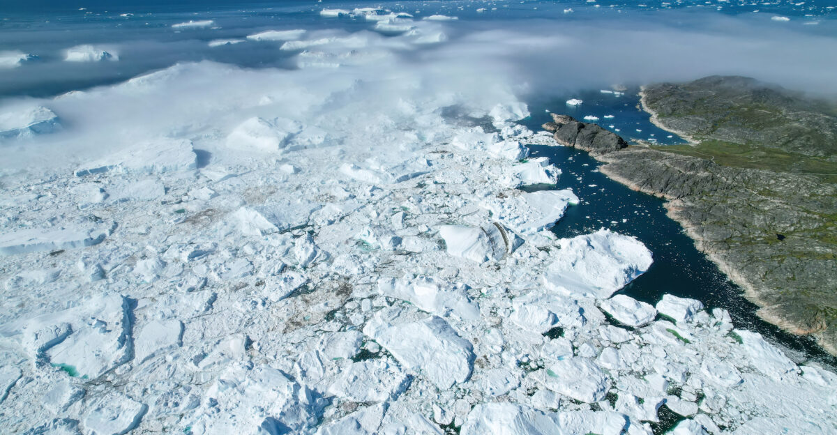 Aerial view of Jakobshavn Glacier at Disko Bay Greenland The calving of this great glacier dumps around 35 billion tonnes of icebergs into Disko Bay every year