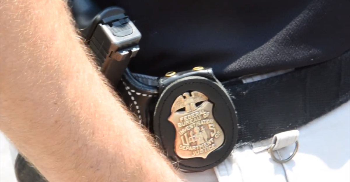 Patch and Weapon on an agent of the FBI