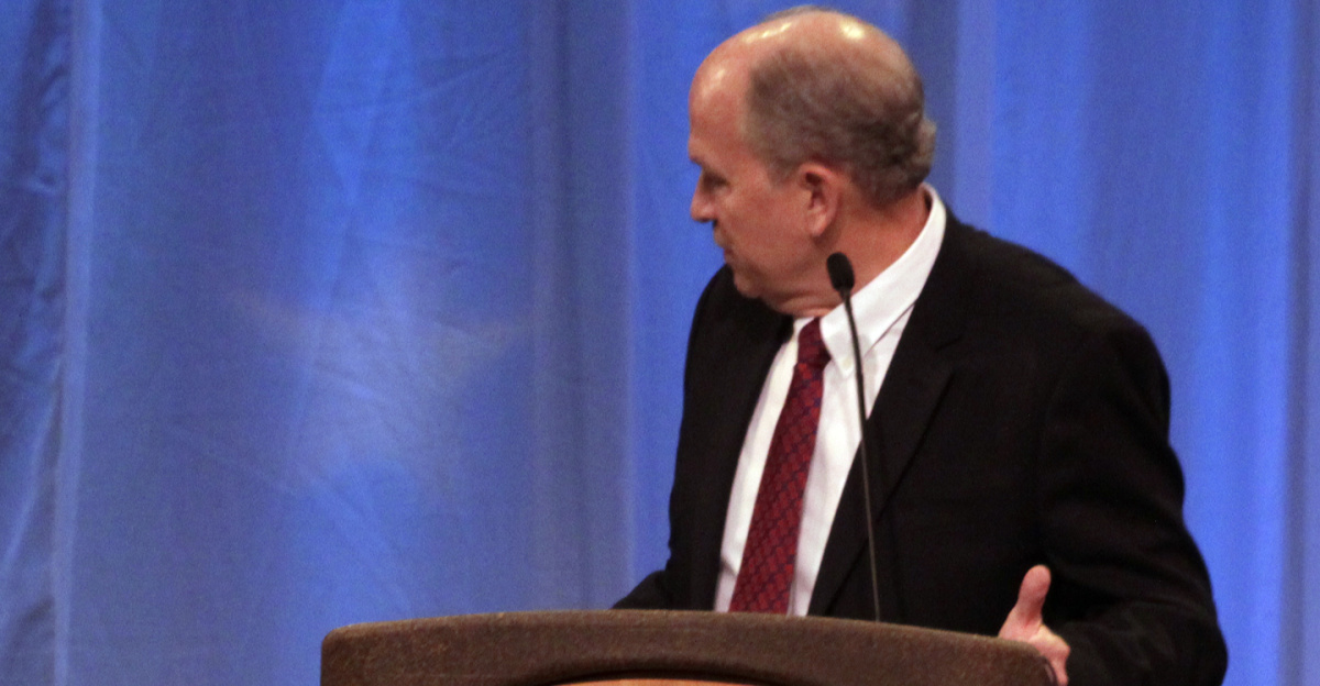 Incoming Alaska Gov. Bill Walker addresses outgoing Alaska Gov. Sean Parnell during Walker's inaugural address Monday, Dec. 1, 2014 in Juneau, Alaska's Centennial Hall.
(James Brooks photo)