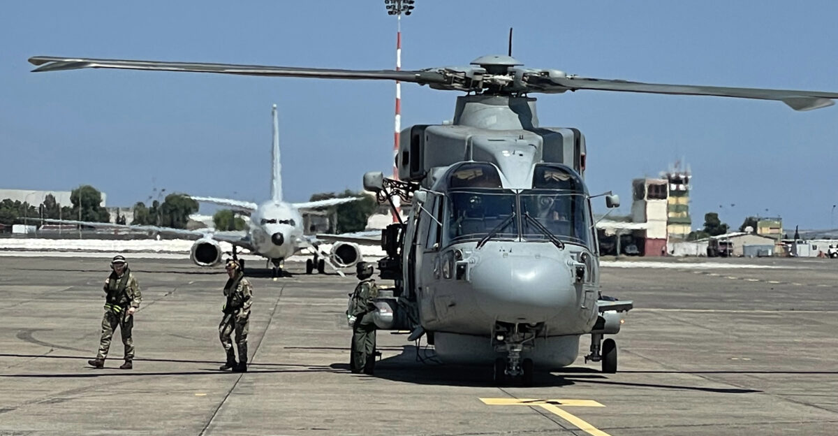 N-TY130-1004 NAVAL AIR STATION SIGONELLA Italy June 14 2021 U S Central Command staff debark a British Royal Navy Merlin MK4 onboard Naval Air Station Sigonella June 14 2021 NAS Sigonella s strategic location enables U S allied and partner nation forces to deploy and respond as required ensuring security and stability in Europe Africa and Central Command U S Navy photo by Lt Karl Schonberg