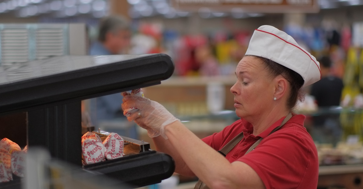 Roasted nuts at the fudge station Buc-ee s is a chain of travel stops along various US highways They sell petroleum-based fuel and offer charging stations for electric cars but the real draw for many people are the fairly large stores which offer clean restrooms soft drinks prepackaged snacks and even low-alcohol beverages - most most especially Jerky Bar-B-Q and fudge I haven t tried the jerky but the Bar-B-Q is quite good and reasonably priced while the fudge is quite good but not so reasonably priced To be fair neither is most fudge I ve found while traveling Buc-ee s has been in the news for the rather high wages they pay as well IIRC starting salaries are a minimum of 17 hour and include benefits such as a 401 k and health insurance But from what I read you work quite hard for that money the stores are routinely full of customers so they keep you constantly busy