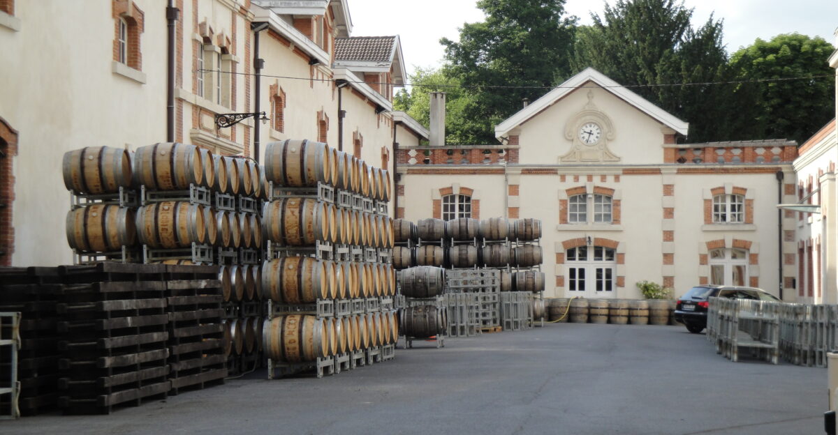 Courtyard of Champagne Krug s facilities in Reims Storage of wine barrels waiting to be used