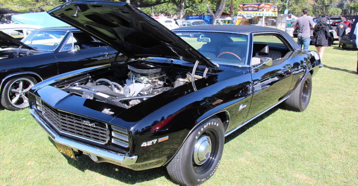 Tuxedo Black In 1969 the Camaro got all new sheet metal except the hood and trunk lid but the drivetrain stayed much the same the grille got a distinctive V shape and the headlights were inset It looked lower wider and more aggressive Available in base RS SS and Z28 Because corporate GM would not allow engines larger than 400 cu in installed in the Camaro Yenko in Pennsylvania and other dealerships installed either the COPO 9561 425bhp solid lifter L72 427 cu in 1015 made or the COPO 9560 430bhp aluminium ZL-1 427 cu in only 69 made