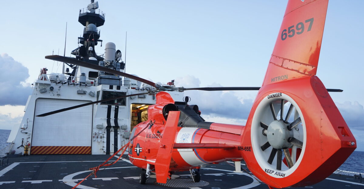 An embarked MH-65 Dolphin helicopter is parked on the flight deck of U S Coast Guard Cutter Stone WMSL 758 June 18 2024 while the cutter makes way in the Florida Straits Stone operated in the Florida Straits and U S 2nd Fleet area of operations in support of maritime stability and security in the region U S Coast Guard photo by Lt j g Gweneth Cantu