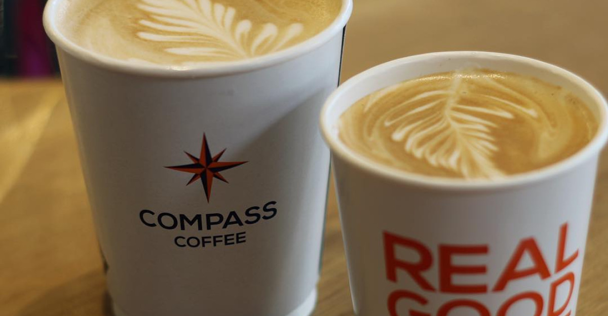 Latte art from Compass Coffee two leaves