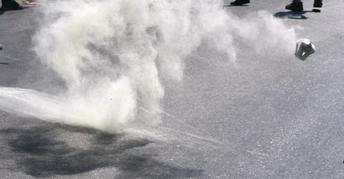 A en Tear gas canister that has just exploded and bounced off the ground during the crackdown of a student demonstration at Chania Crete
