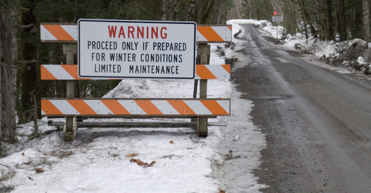 Skykomish WA 2-10-07 - Winter Warning signs warn drivers of the Index Galena Road that has not been able to be repaired from the November Rains and flooding due to winter conditions FEMA s Public Assistance Program helps local governments repair damaged roads from a declared disaster Marvin Nauman FEMA photo