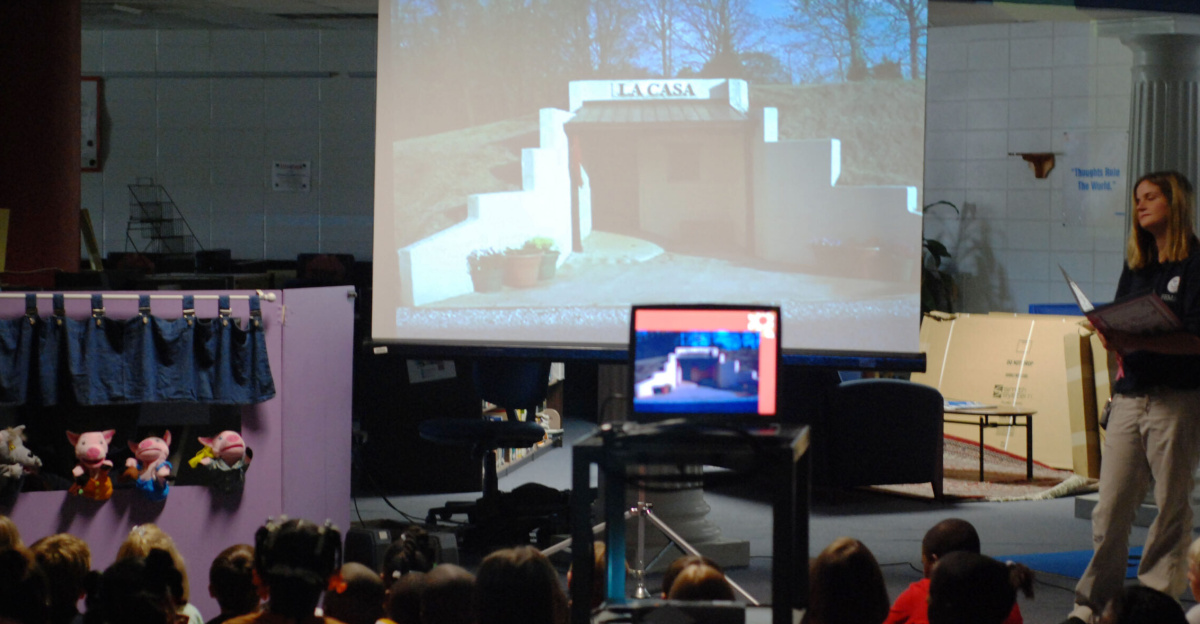 Pascagoula, Miss., June 26, 2008--Students enrolled in Pascagoula School District's Summer Explorations program watch a puppet show presented by FEMA in the Classroom (FITC) members Neily Chapman, Kiiva Williams and Jennifer Smits. FITC is a new program created by the Mississippi Transitional Recovery Office public affairs office to present preparedness and general FEMA information to elementary school-aged children. Bryon Wolcott/FEMA.