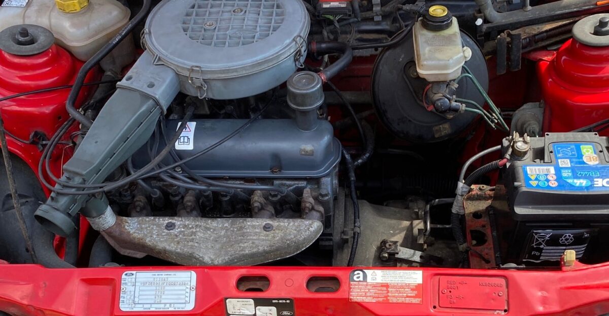 Engine compartment view of a 1989 Ford Fiesta Mk3 showing the HCS High Compression Swirl engine in 999cc 1 0L format