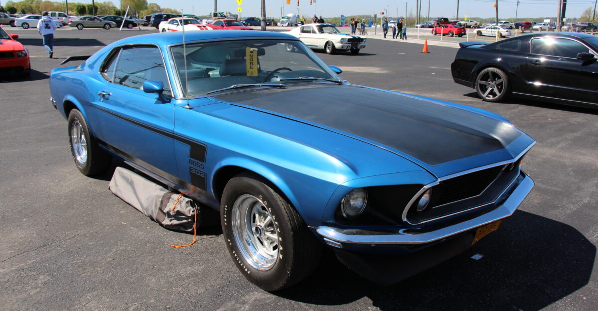 Acapulco Blue The 1969 Mustang got a new body nearly 4 inches longer than the 1968 model The Fastback was now called the Sportsroof This model the Boss 302 was built for Trans Am homologation to race against the likes of the Cuda AAR TA Challenger and Z28 Camaro The car featured reflective c-stripe front and rear spoilers and the fake rear fender scoops of the regular 1969 Mustangs were eliminated The engine in the Boss 302 was rated at 290bhp conservative G code 351 Cleveland heads on a Tunnel Port 302 Windsor Block 1628 1969 Boss 302s made It also got disc brakes and a larger sway bar Other Sportsroofs available were Boss 429 for NASCAR homologation and Mach I in 351 or 428 Cobra Jet Hardtops and Convertibles also available in base models Photographed at the 50th Anniversary of the Mustang celebrations at the Charlotte Motor Speedway April 2014