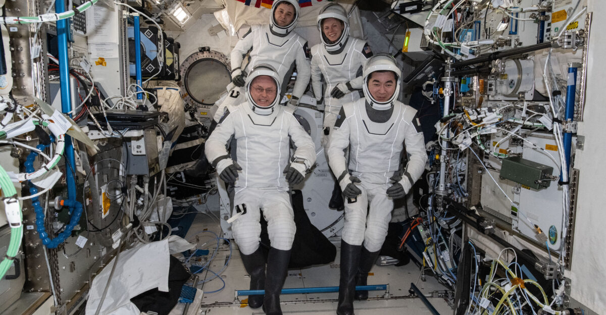 iss074e0046389 Jan 9 2025 - Four SpaceX Crew-11 members gather together for a crew portrait wearing their Dragon pressure suits during a suit verification check inside the International Space Station s Kibo laboratory module Clockwise from bottom left are NASA astronaut Mike Fincke Roscosmos cosmonaut Oleg Platonov NASA astronaut Zena Cardman and JAXA Japan Aerospace Exploration Agency astronaut Kimiya Yui