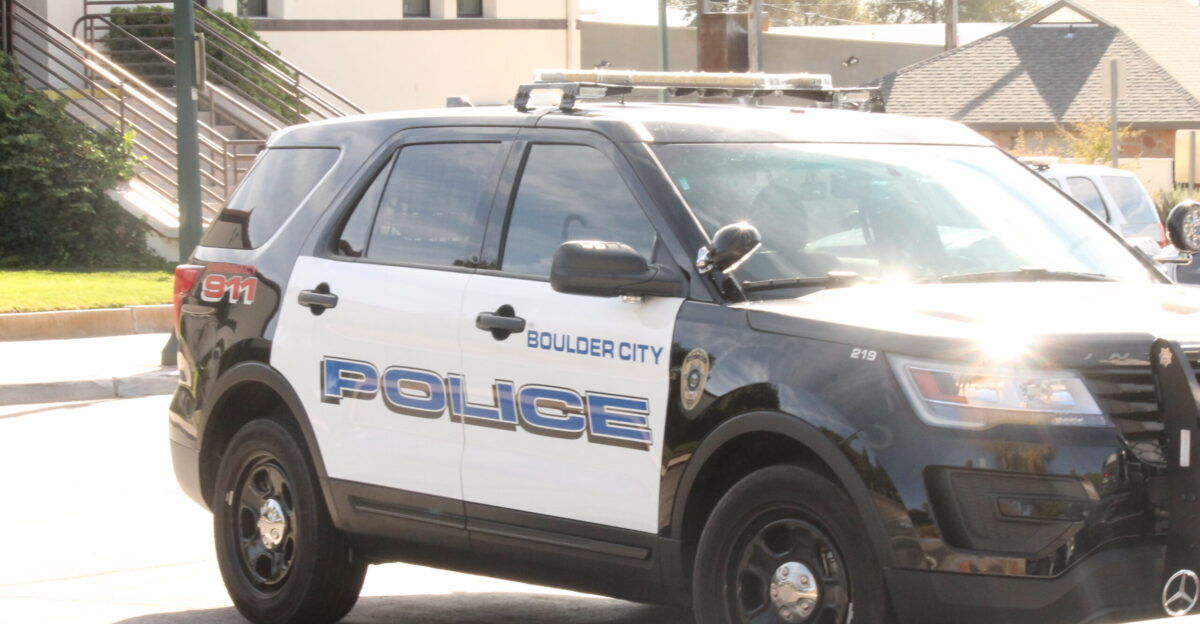 A 2016 or 2017 Ford Police Interceptor Utility of the Boulder City Police Department parked in from of the station