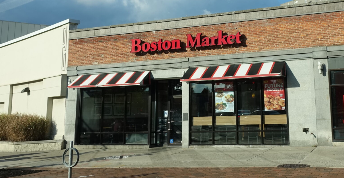 The Boston Market and Red Mango within Building G at the south end of the eastern half of the Fresh Meadows Place Shopping Center, at the northeast corner of 188th Street and 64th Avenue in Fresh Meadows, Queens. This is one of the several small shop buildings along 188th Street through the center of the mall.