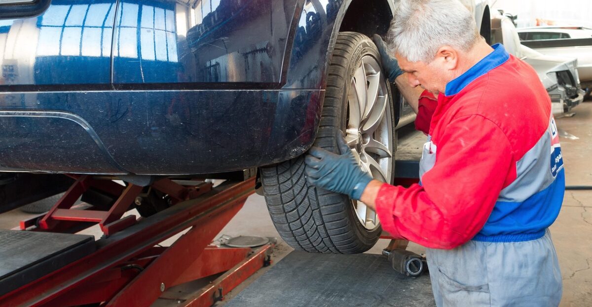 auto repair shop repair lifting platform car mechanic workwear master professional man of the fold workshop check responsibility specialist expert help fastening assembly tire car mechanic car mechanic car mechanic car mechanic car mechanic workwear check expert expert help