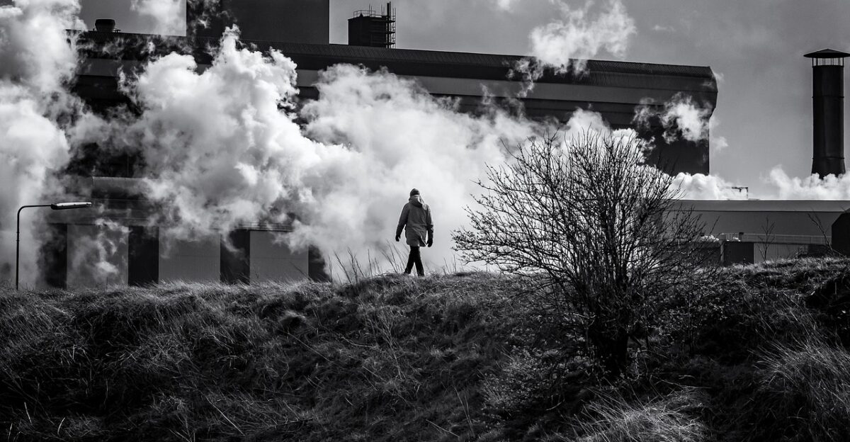 clouds factory man walking nature ijmuiden netherlands black and white