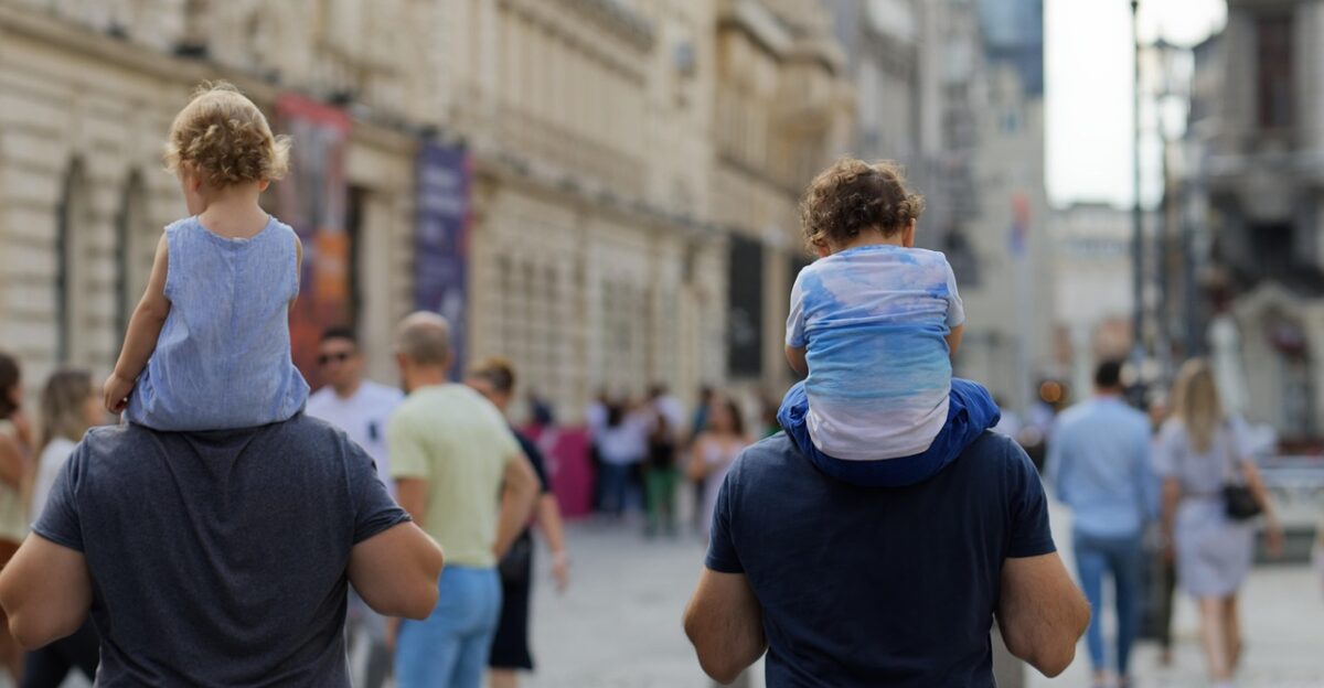 people walking promenade children street urban relaxation weekend men fathers family snapshot old town city capital