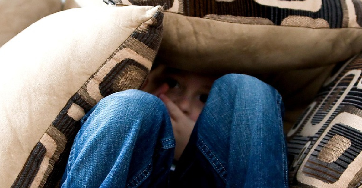 little boy, hiding, sad, child, fear, pillows, couch, pillow fort, bare feet, hide, hide and seek, brown fear, brown couch, sad, fear, fear, fear, fear, fear