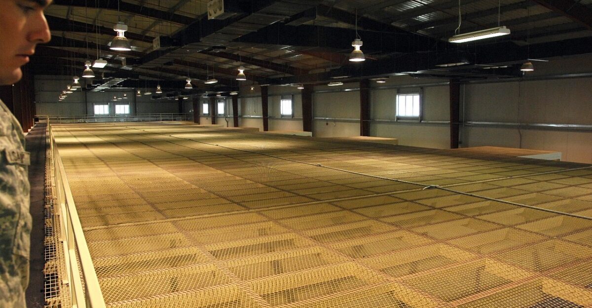 afghanistan detention center prisoners cells viewing downward buildings structure prison jail soldier army military brown army brown prison