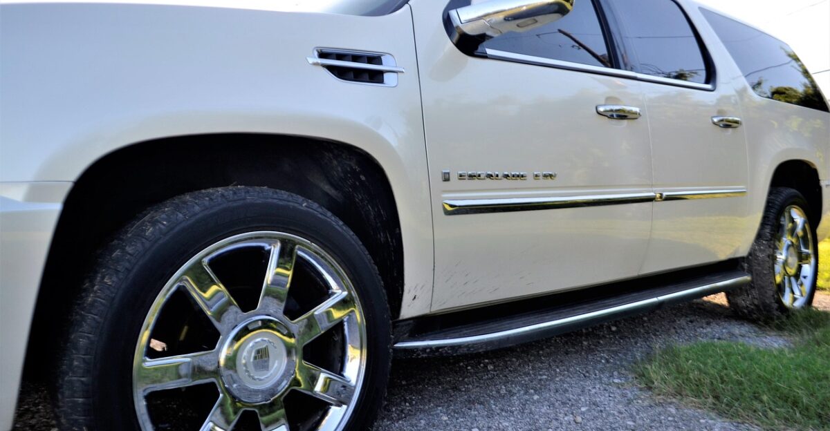 pre-owned cadillac escalade front side door panel angle view rear view mirror tinted windows sky sunny grass wheel tire beige sports utility vehicle suv car used car automobile all-wheel automotive transport driving 4x4 taillight break light gas cap back door bumper high raised street parked transportation auto modern side speed sport drive road outdoor travel asphalt day empty summer used car sales dealership car salesman used car sales disk star drum roller caster circuit circulation circumvolution cycle gyration gyre hoop pivot pulley ratchet ring roll rotation round spin car wallpapers trolley turn twirl whirl nature convertible jeep limousine machine motor pickup ride station wagon truck van wagon bucket buggy compact conveyance coupe hardtop heap jalopy junker motorcar blue car blue door blue truck blue sales