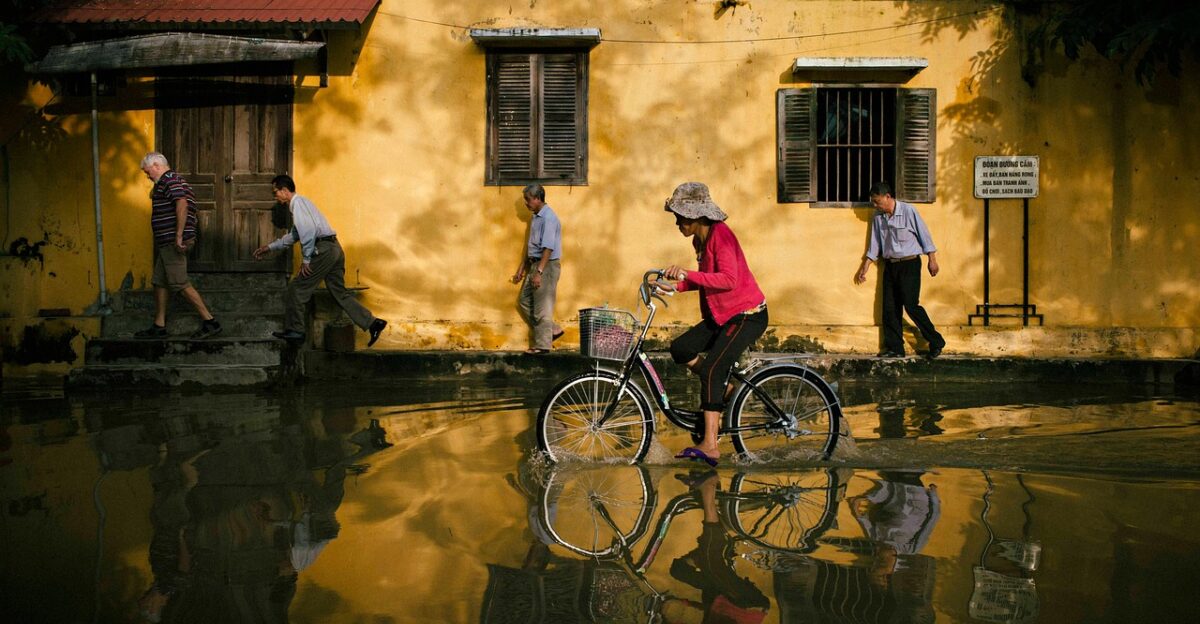 biking street flood city bike bicycle bicycle ride riding bike flooding water water reflection road nature hoi an vietnam flooded street