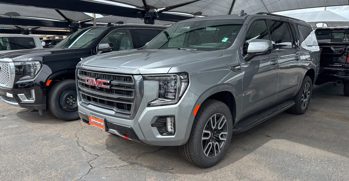 GMC Yukon AT4 SUV on car dealership lot