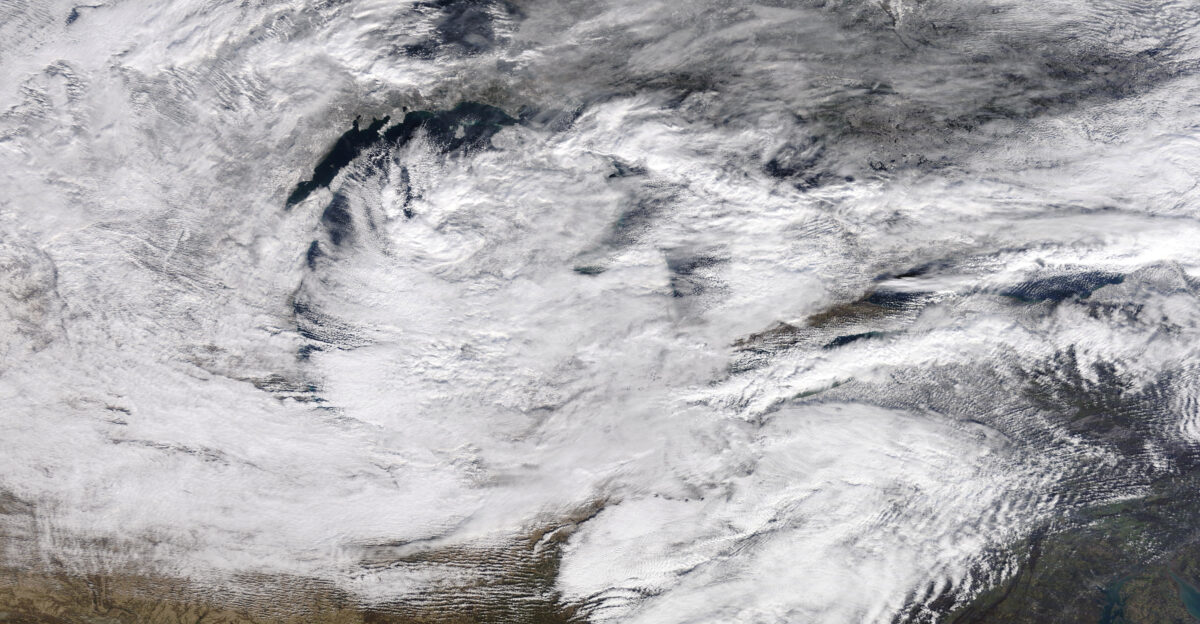This true-color image of the Great Lakes region was captured in late morning hours on November 18 2022 at 11 15 A M EST 16 15 UTC by the Moderate Resolution Imaging Spectroradiometer MODIS instrument flying aboard NASA s Terra polar-orbiting satellite At the time this was captured there was a polar wind blowing from the west across 50 F 10 0 C waters across the Great Lakes which resulted in multiple lake-effect snow bands forming on Lakes Michigan Huron Ontario and especially on Lake Erie which brought a snow-band into the Buffalo Metropolitan Area where areas south of Downtown Buffalo saw multiple feet of snow
