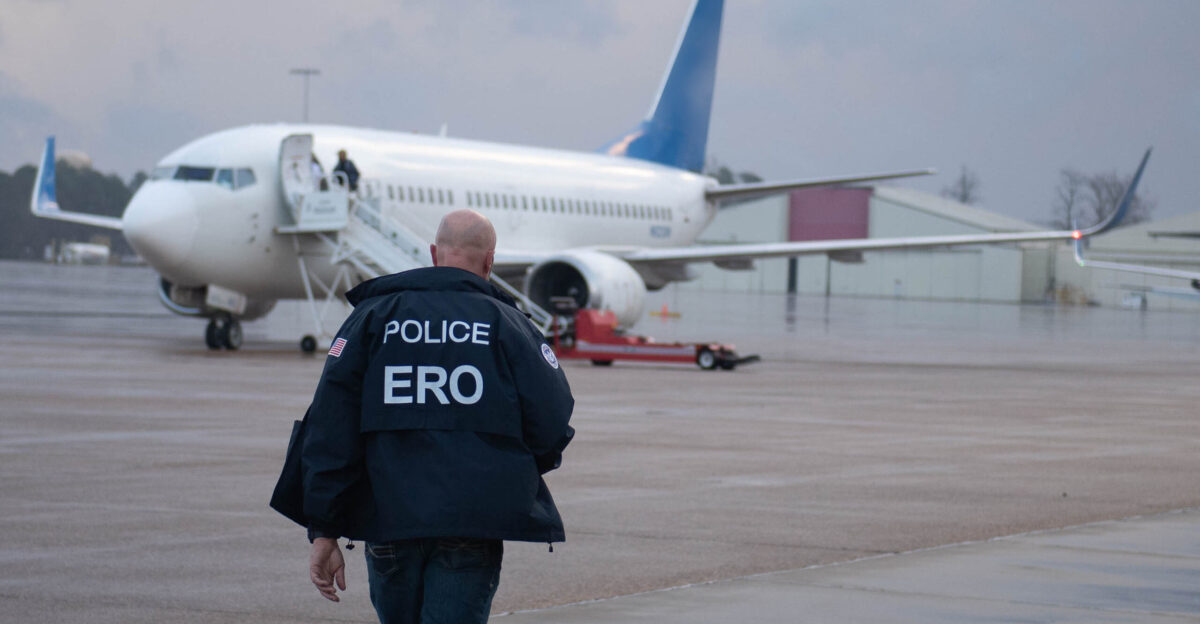 An Enforcement and Removal Operations ERO deportation officer brings paperwork to the charter flight to Guatemala